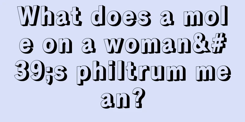 What does a mole on a woman's philtrum mean?