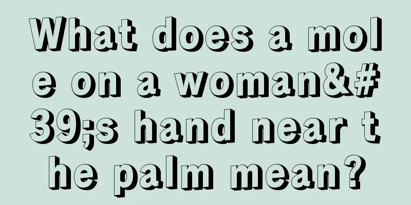 What does a mole on a woman's hand near the palm mean?