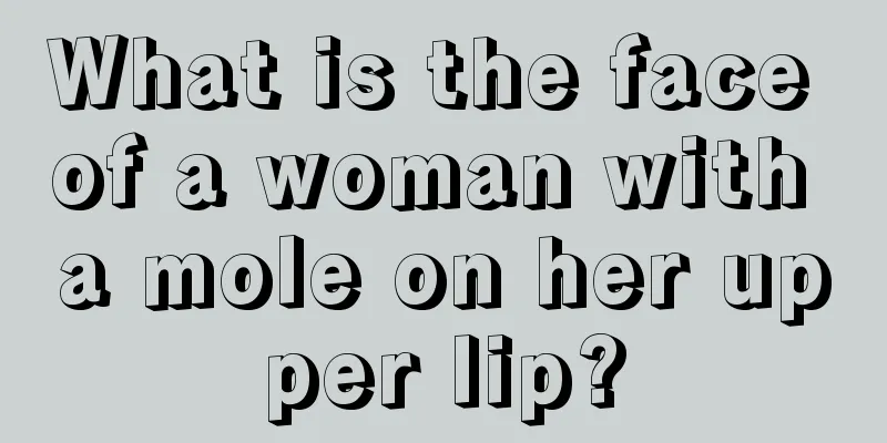 What is the face of a woman with a mole on her upper lip?