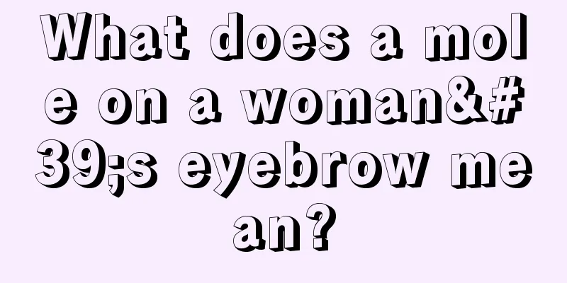 What does a mole on a woman's eyebrow mean?