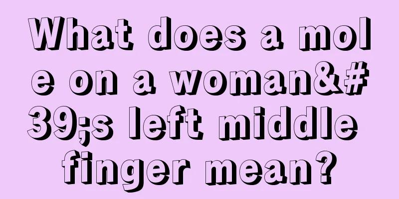 What does a mole on a woman's left middle finger mean?