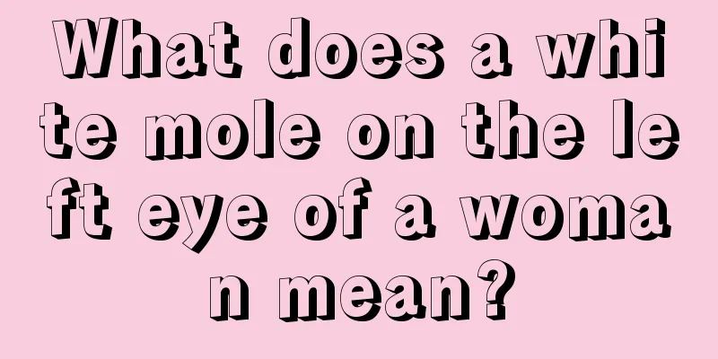 What does a white mole on the left eye of a woman mean?