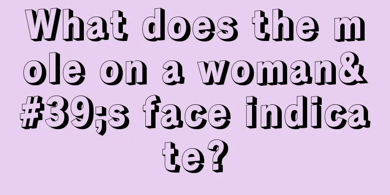 What does the mole on a woman's face indicate?