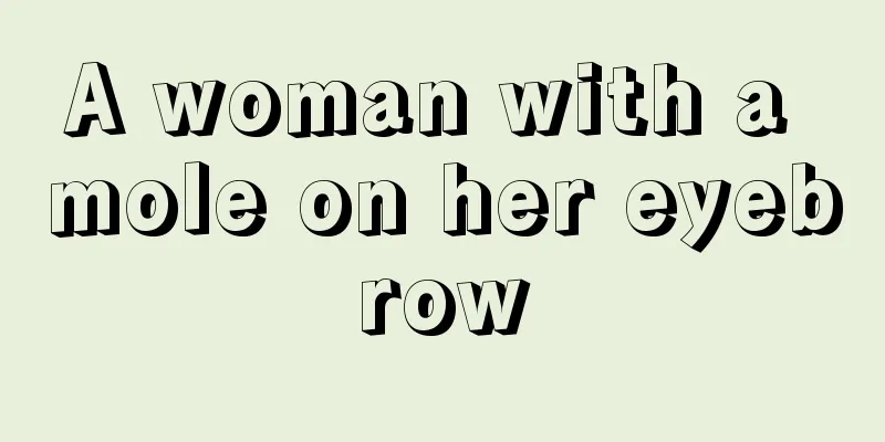 A woman with a mole on her eyebrow