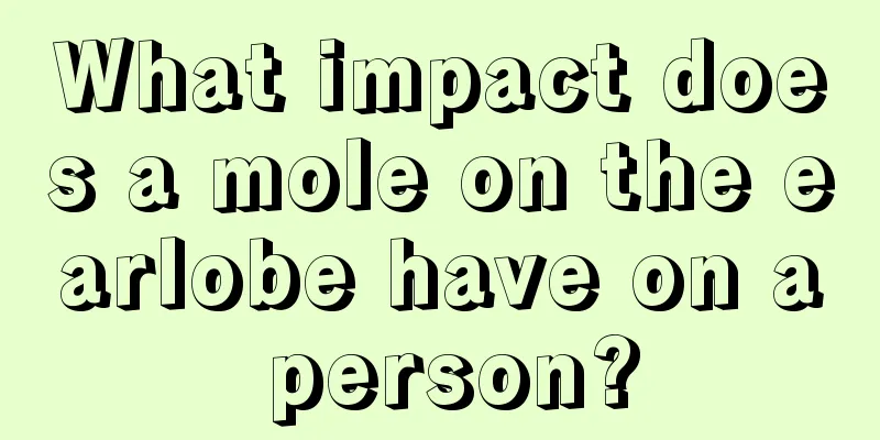 What impact does a mole on the earlobe have on a person?
