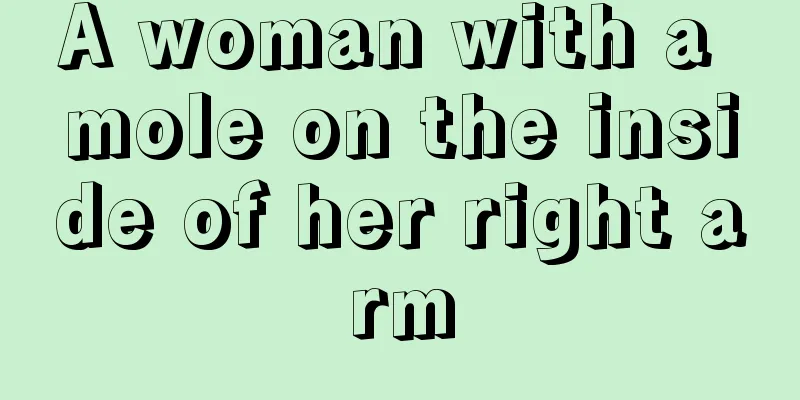A woman with a mole on the inside of her right arm