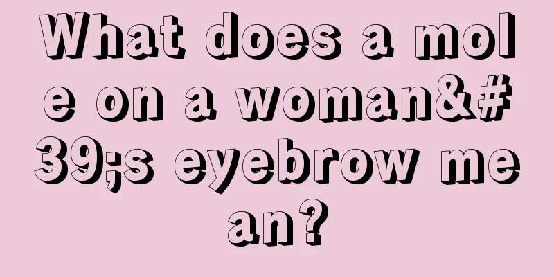 What does a mole on a woman's eyebrow mean?
