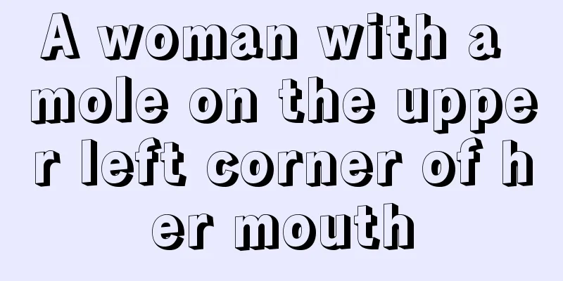 A woman with a mole on the upper left corner of her mouth