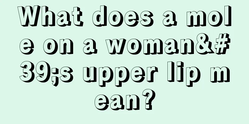 What does a mole on a woman's upper lip mean?